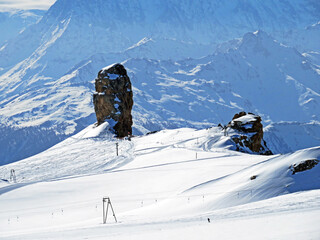 Impressive natural stone tower above the glacier de Zanflueron in the alpine mountain massif Les...