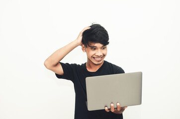 An Asian man wearing a casual black T-shirt carries a laptop with the expression of finding ideas