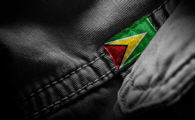 Tag on dark clothing in the form of the flag of the Guyana