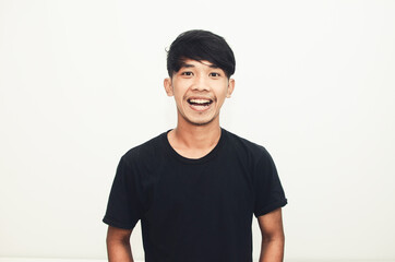 Smiling handsome Asian man in casual black t-shirt