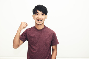 Asian man smiles in casual shirts with a cheerful smile expression