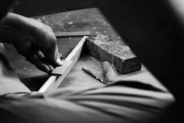 A Mechanic Does Carpenter Jobs With Wood, Saw, Hammer, Nail, Plus And Other Tools