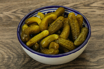 Pickled gherkin in the bowl