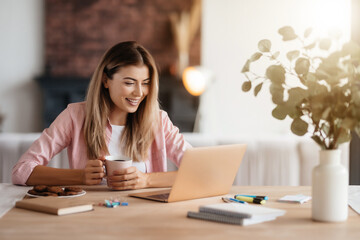 Joyful woman starting her working day with positivity