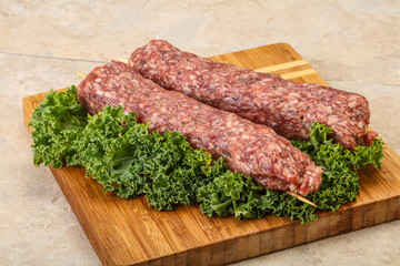 Raw minced beef kebab skewer