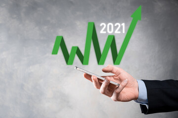 Plan business growth in year 2021 concept. Businessman plan and increase of positive indicators in his business, Growing up business concepts.