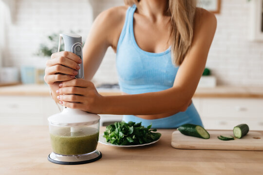 Slim woman keeping up healthy diet by sticking to smoothies