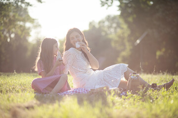 Fototapeta premium This is our perfect day. Mother and daughter at the park.