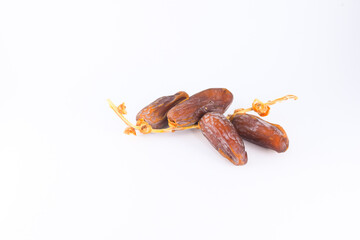Fresh and delicious dates on a white isolated background