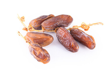 Fresh and delicious dates on a white isolated background