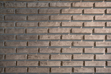 Vintage grunge old grey brick concrete  wall with shade of light and shadow. Texture and background concept.