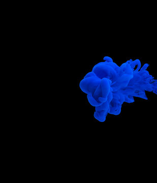 explosion of acrylic blue paint in water with bubbles. Black background