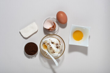 Egg White Face Mask ingredients. Whipped egg white, honey, coffee grounds.