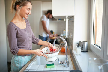 adult couple having fun in the kitchen