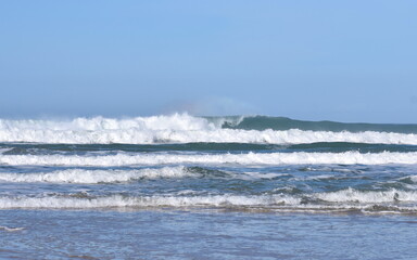 Surf breaking at the beach Holywell Bay, Cornwall