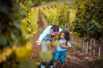 Fototapeta premium Father and son in the vineyard.