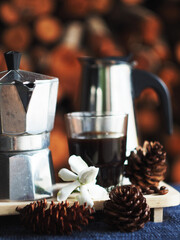 moka pot coffee maker morning fresh with firewoods background 