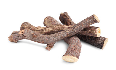 Dried sticks of liquorice root on white background