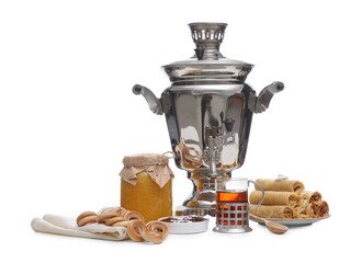 Traditional Russian samovar and treats on white background