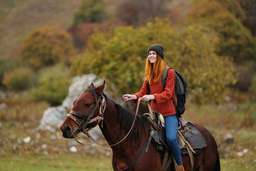 Obraz premium pretty woman in nature walk fun horse with travel