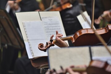 violin during a concert , with hands and a bows 