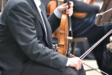 violin during a concert , with hands and a bows 