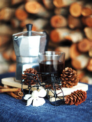 moka pot coffee maker morning fresh with firewoods background 