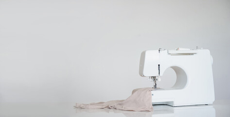 New sewing machine on grey background.