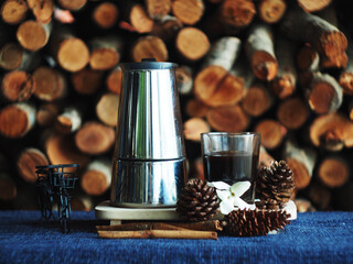 moka pot coffee maker morning fresh with firewoods background 