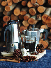 moka pot coffee maker morning fresh with firewoods background 