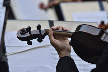 violin during a concert , with hands and a bows 