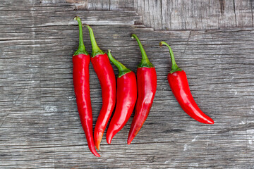 Red chili peppers on a wooden table, harvesting