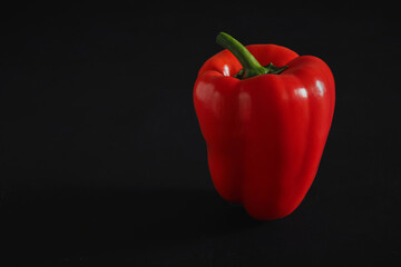 red bell pepper on black background