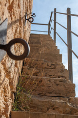Vertical shot of a castle stairs leading to the second floor