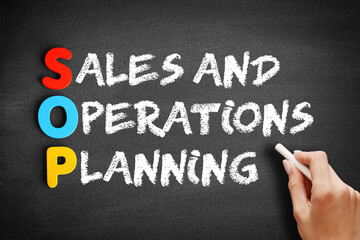 SOP - Sales and Operations Planning acronym, business concept on blackboard.