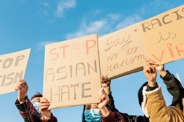Group of demonstrators protest on the street for equal rights - Asian people demonstrators wearing...