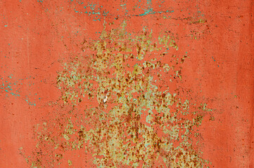 Old flaky paint on a metal surface. Red green grunge texture
