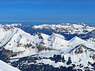 Spring icy alpine atmosphere on the Swiss mountain peaks viewed from the Les Diablerets massif...