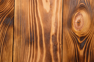 Background from scorched boards, close-up of wood texture