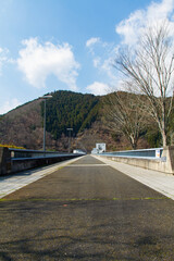 The road above the weir of the Hiyoshi Dam in Nantan City, Kyoto Prefecture, Japan