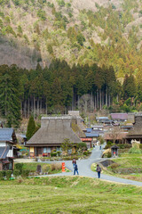 Rice fields and old thatched-roof houses in Kitamura, Miyama Kayabuki no Sato, Nantan City, Kyoto Prefecture, Japan