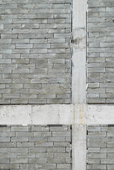 Wall of texture gray concrete bricks
