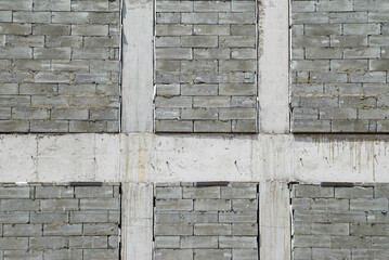 Wall of gray concrete bricks