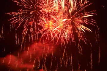 Fototapeta na wymiar Red holiday night fireworks