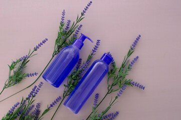 Lavender liquid, shampoo. Bath cosmetics lavender flowers. Natural spa products. Beauty concept.