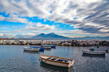 Fototapeta na wymiar Boats in the ancient port of the city of Naples, Italy.