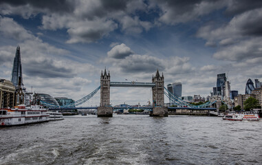 Fototapeta na wymiar A panoramic shot of the Tower Bridge Southwark in the UK on a cloudy day background