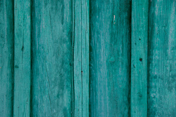 Wood texture, background with copy space. Old wooden barn green or emerald