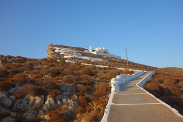 Pedestrian path leading to the famous whitewashed Panagia church in Folegandros cyclades Greece 