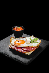 Healthy breakfast with eggs, dry meat and vegetables